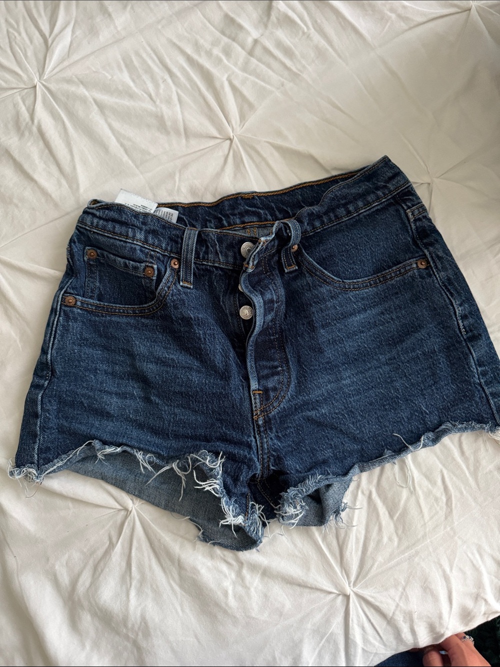 Levi’s High-Rise Dark Blue Denim Cutoff Shorts with Raw Hem